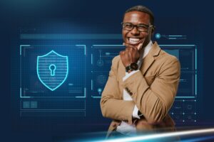 Confident IT professional smiling in front of digital security shield graphic, representing Xtel CIO Program for Compliance, Insurance, and Operations.